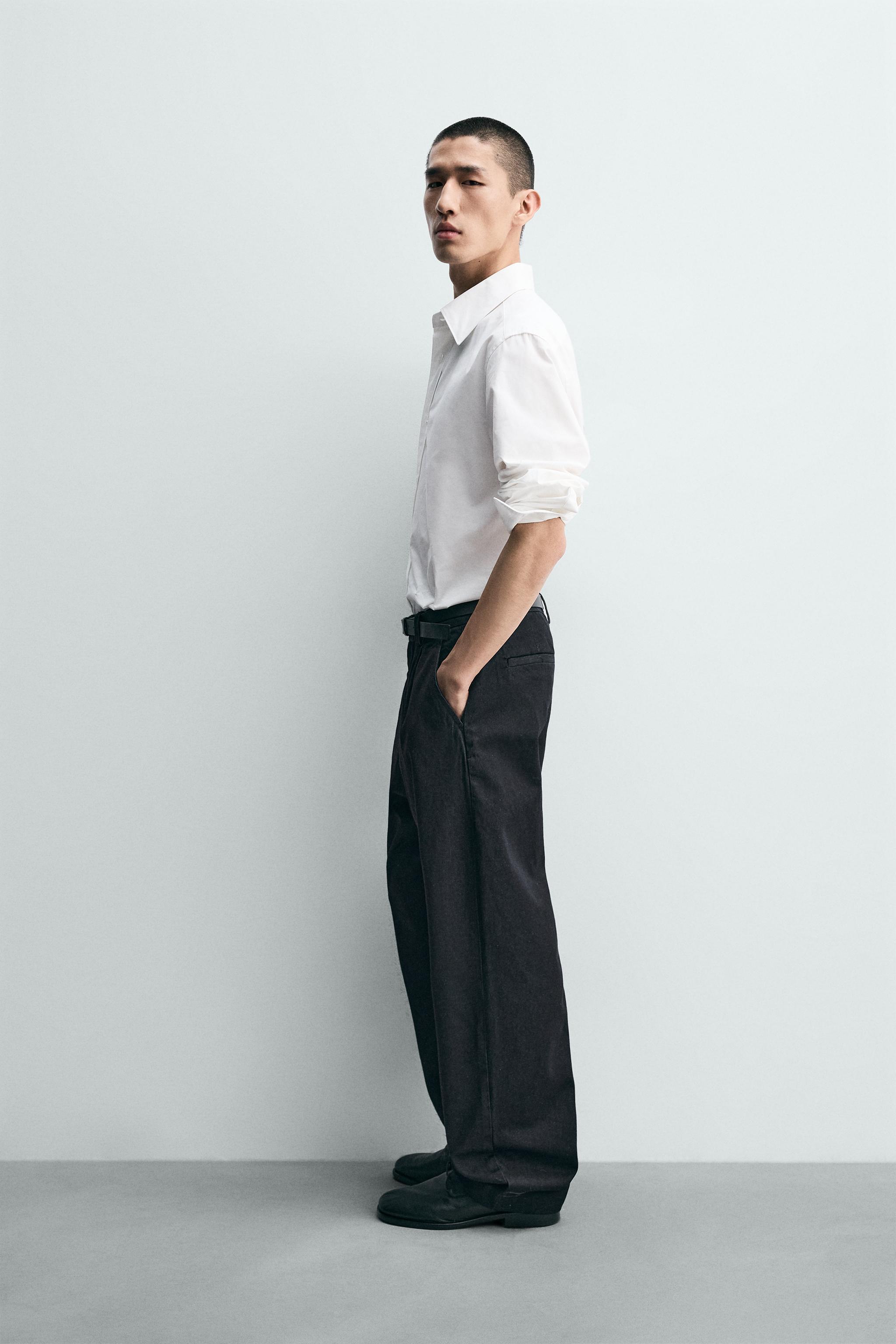 PANTALON CHINO EN DENIM À PLIS