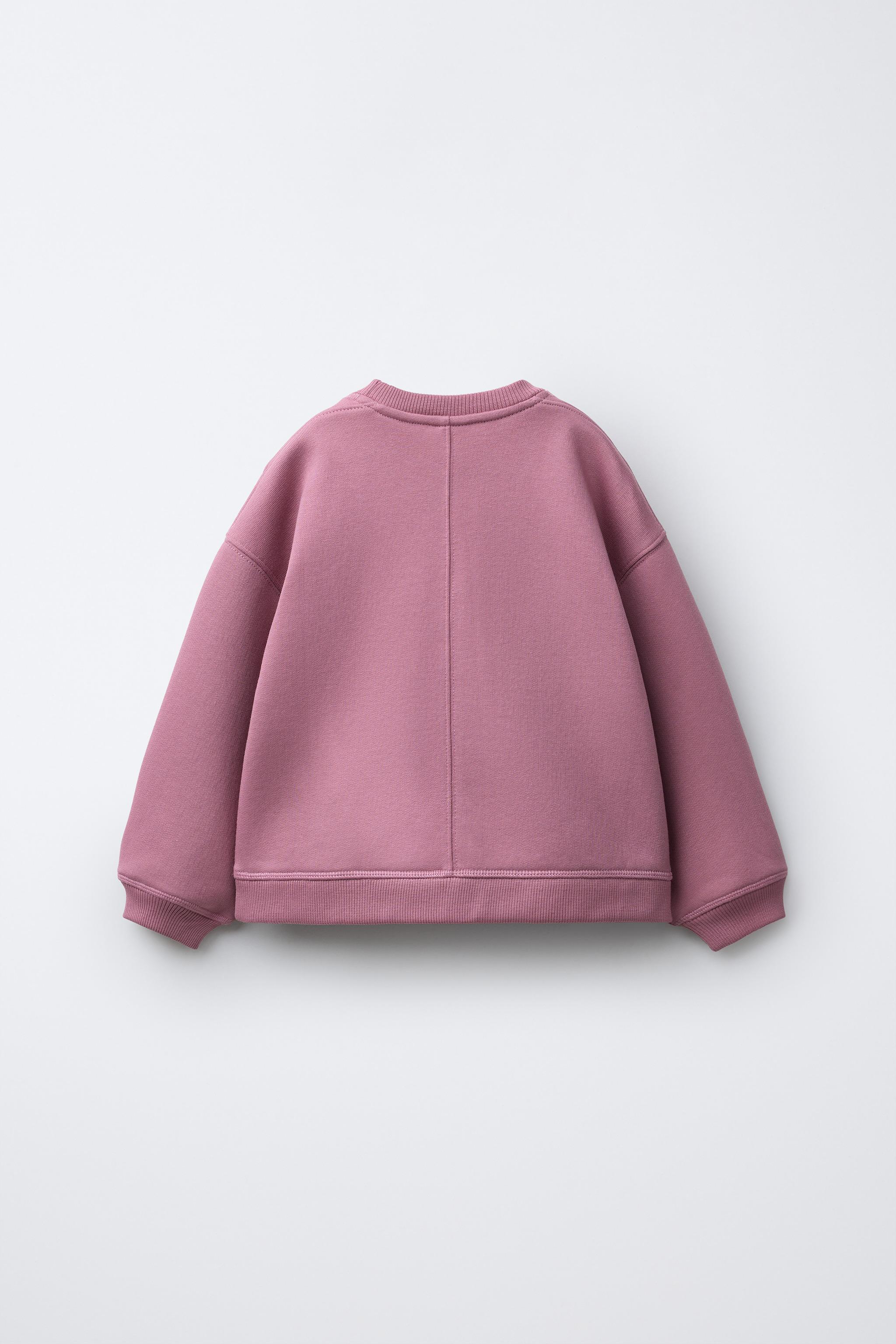 RAISED TEXT SWEATSHIRT
