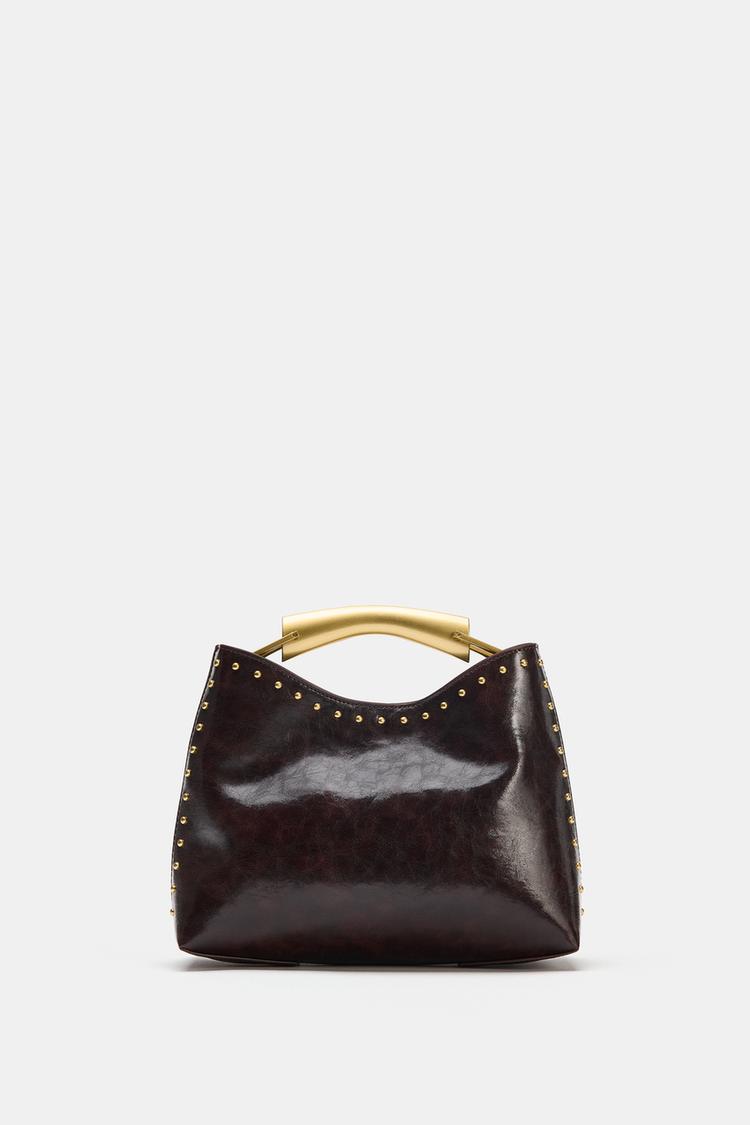 BOLSO DE MANO TACHAS