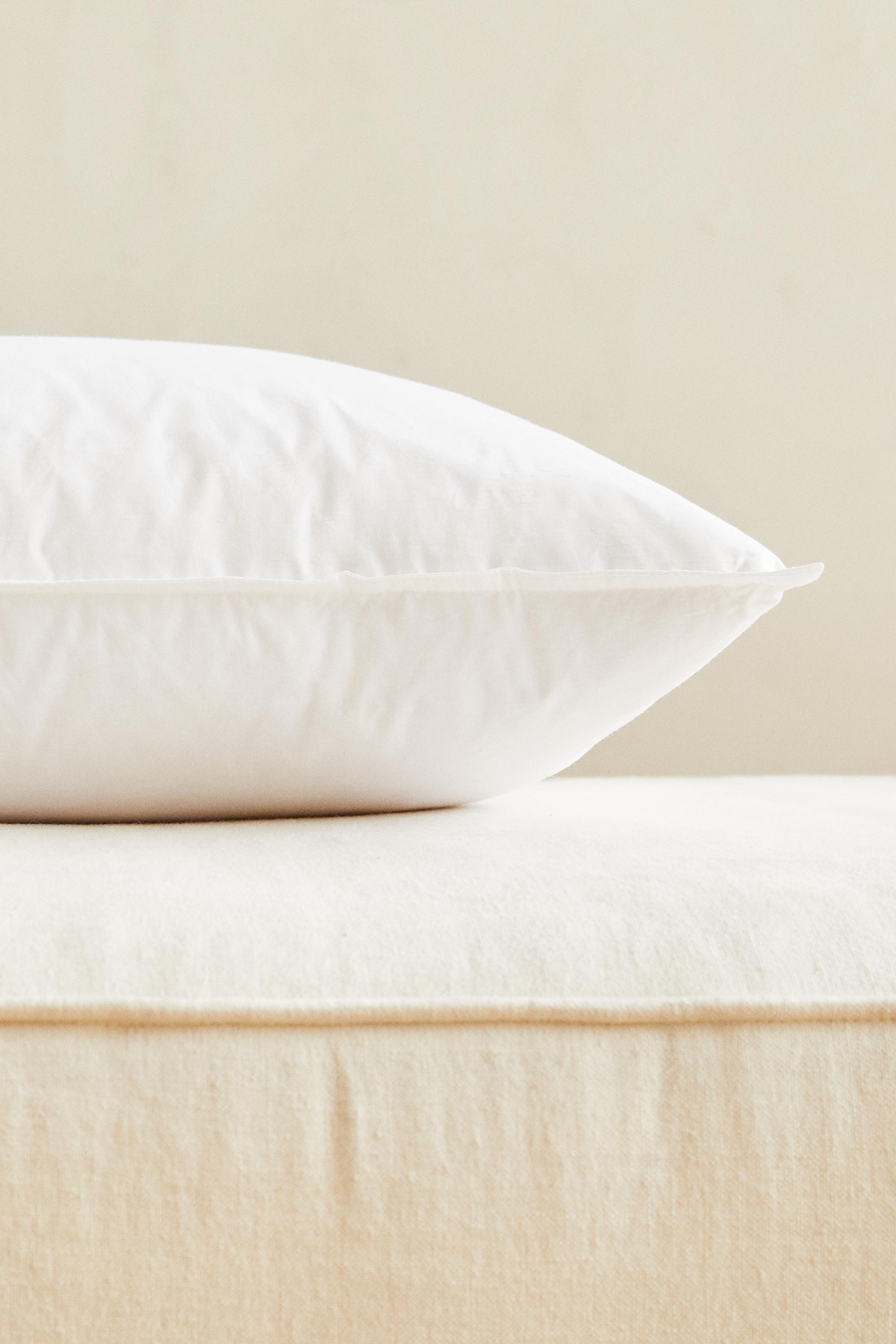 FEATHER CUSHION FILLING WITH A COTTON COVER