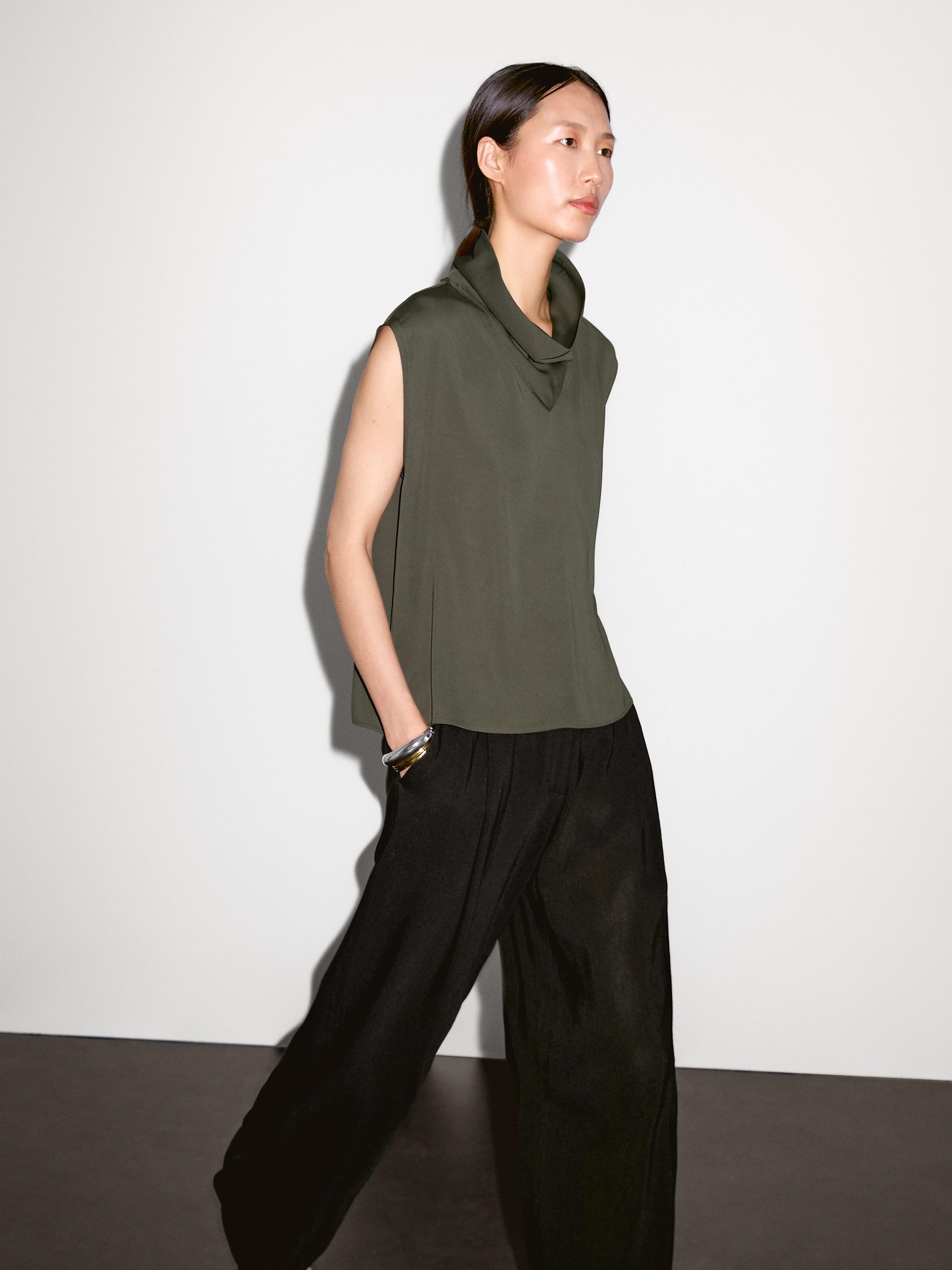 Flowing blouse with draped neck detail