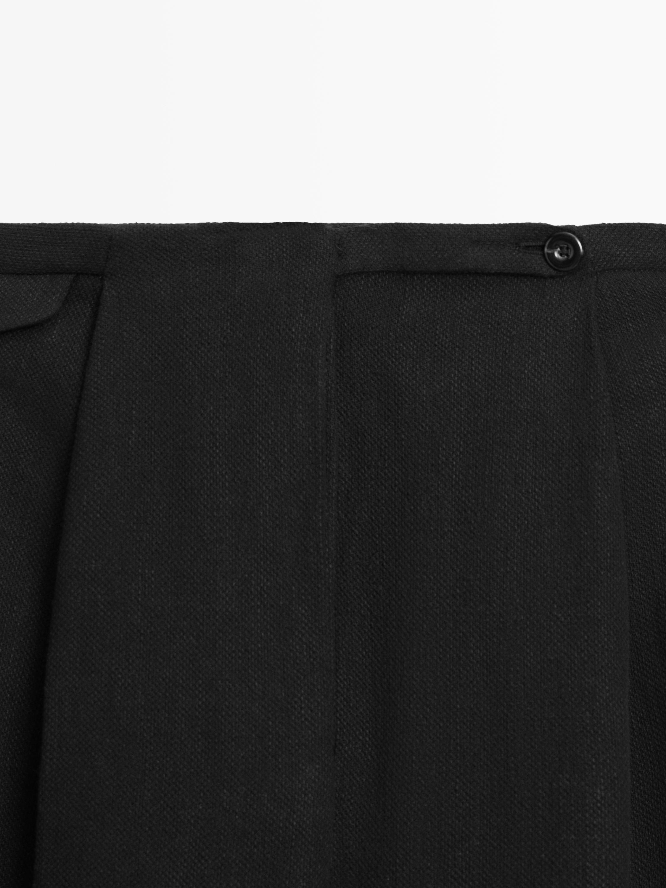 Flowing linen blend trousers with pocket details
