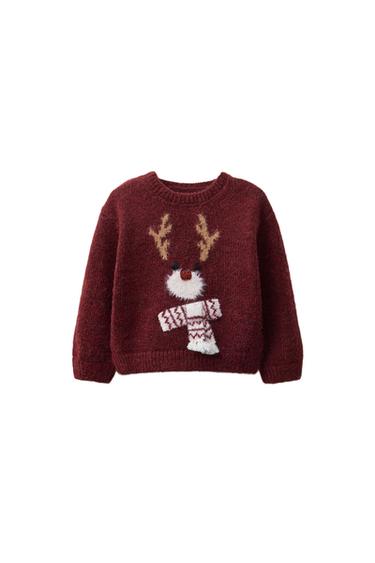 Front view of a maroon jumper with a round neck, long sleeves, and a reindeer embroidery on the front. Button fastening on the shoulder.