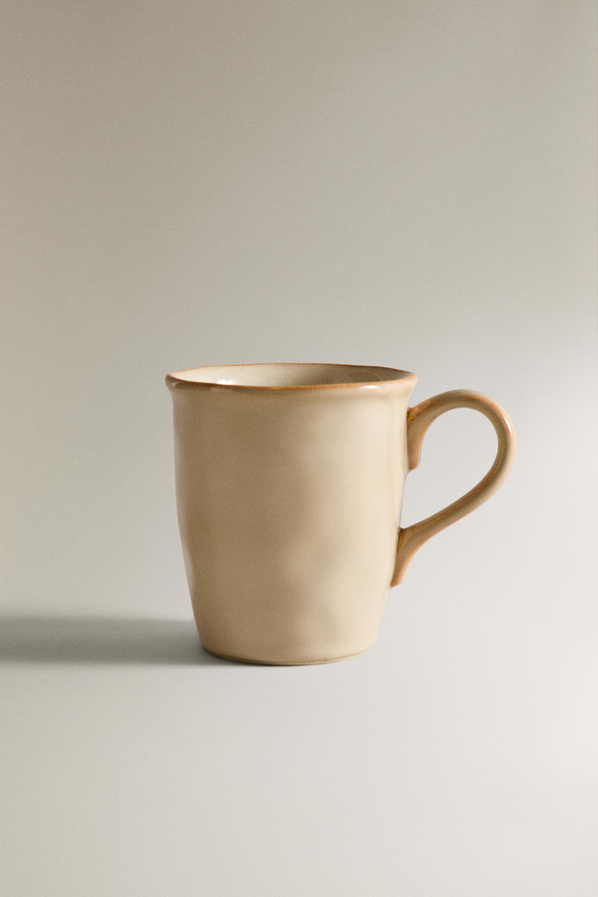 STONEWARE MUG WITH IRREGULAR EDGE