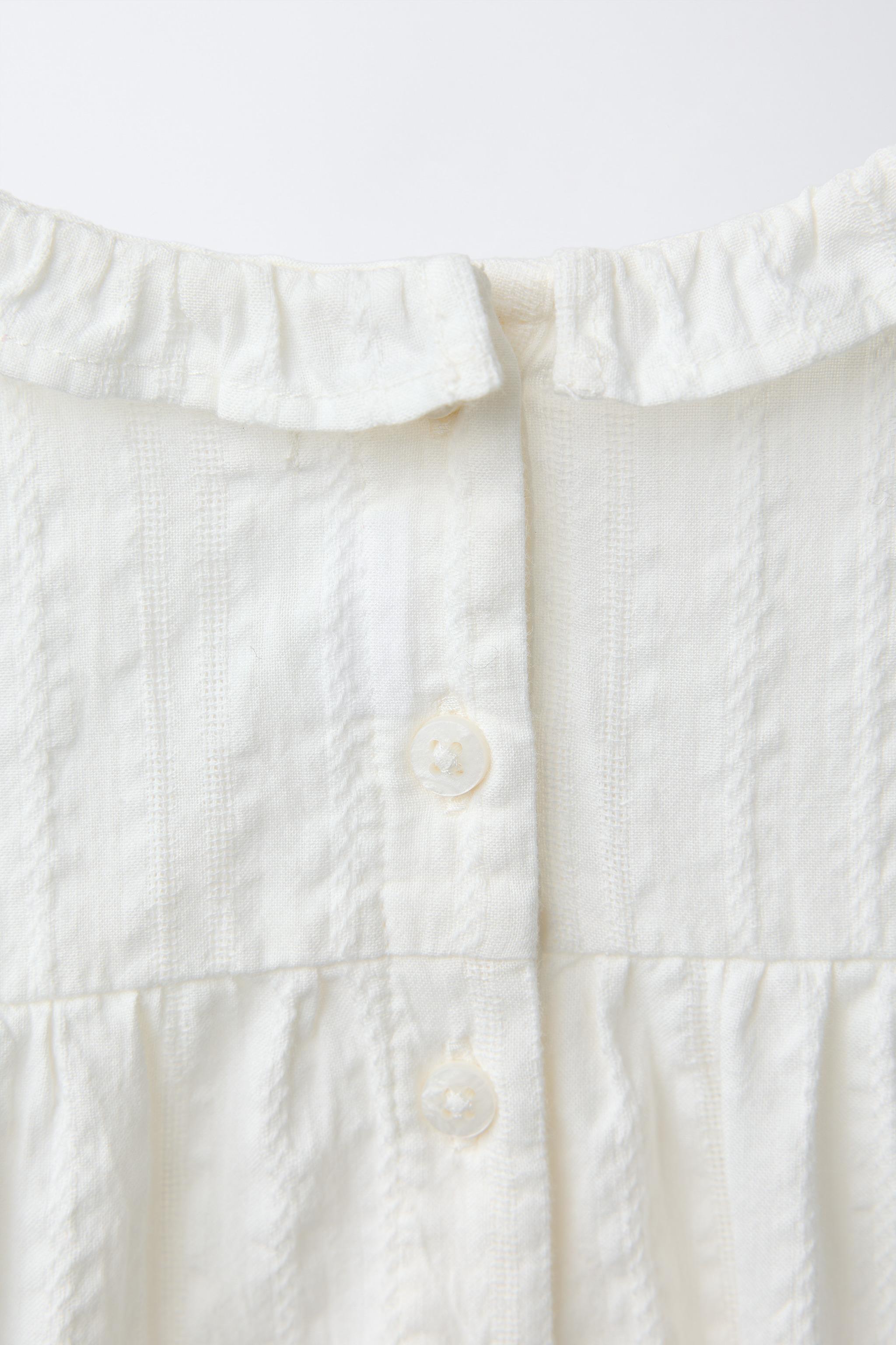 EMBROIDERED LADDER STITCH BODYSUIT