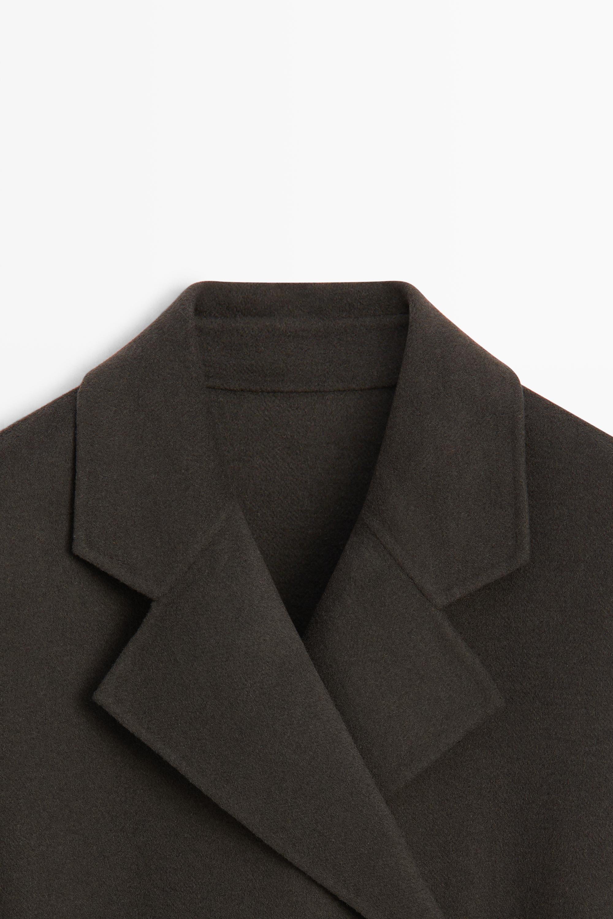 Manteau long croisé détail ceinture