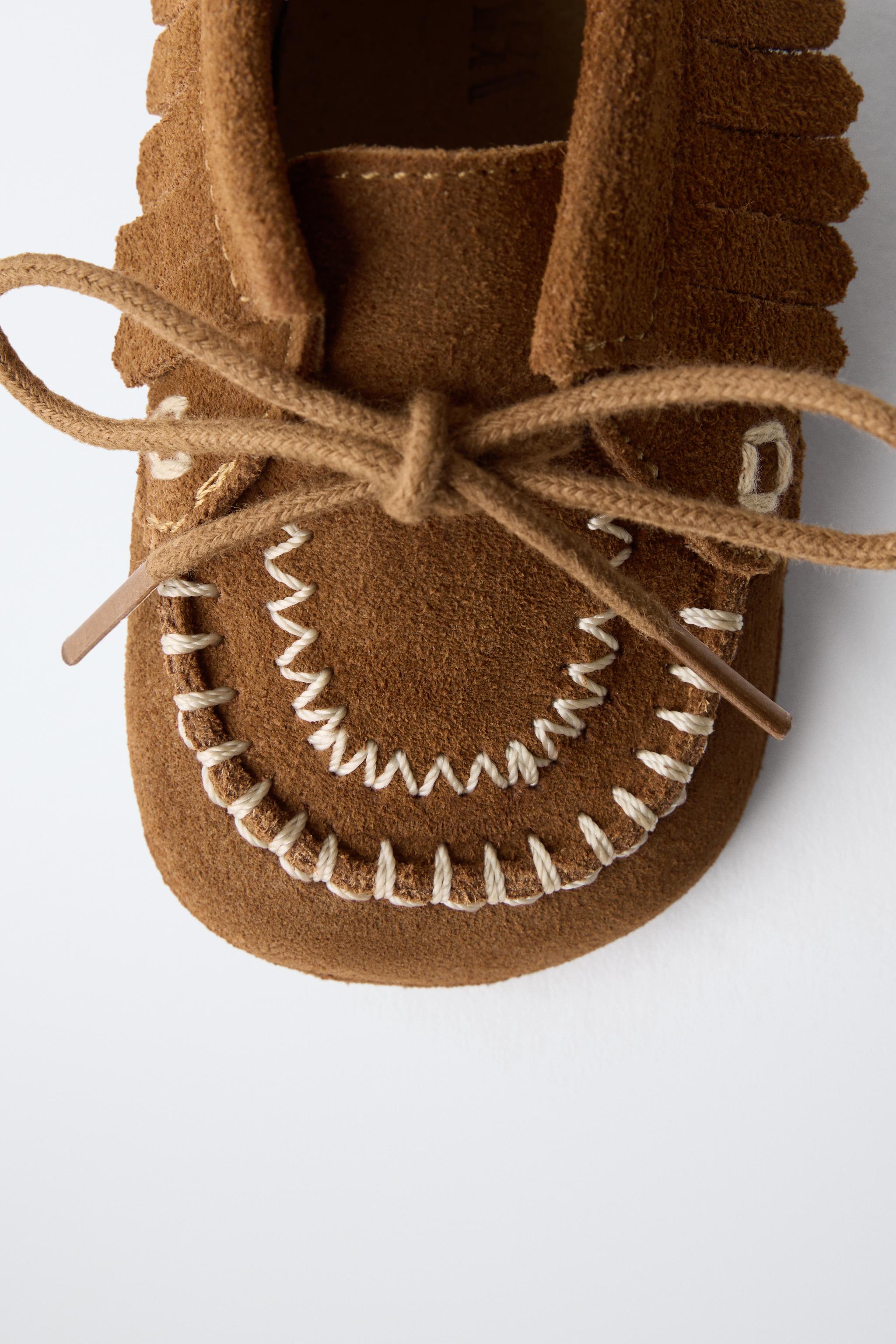 BOTTINES EN CUIR À FRANGES