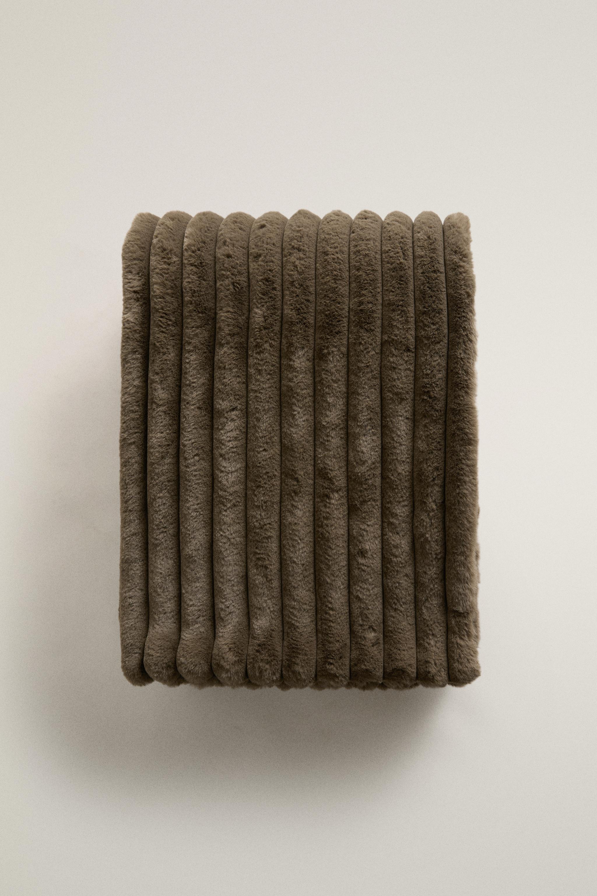TUBULAR EMBOSSED FUR BLANKET