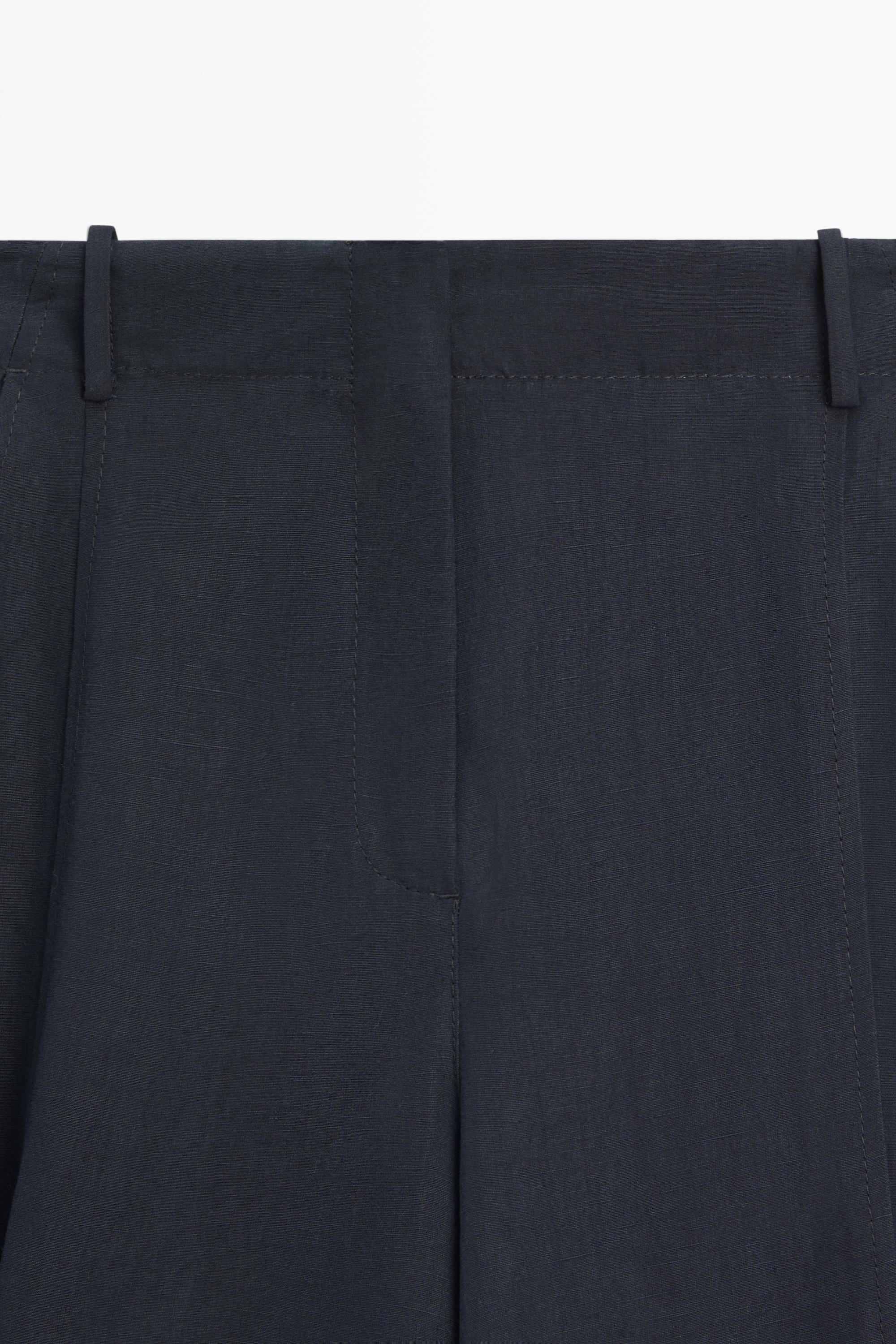 Flowing linen blend pants with buttoned tab detail