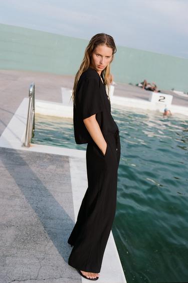 WIDE-LEG TROUSERS WITH ELASTIC WAISTBAND - Black by Zara - Image 1