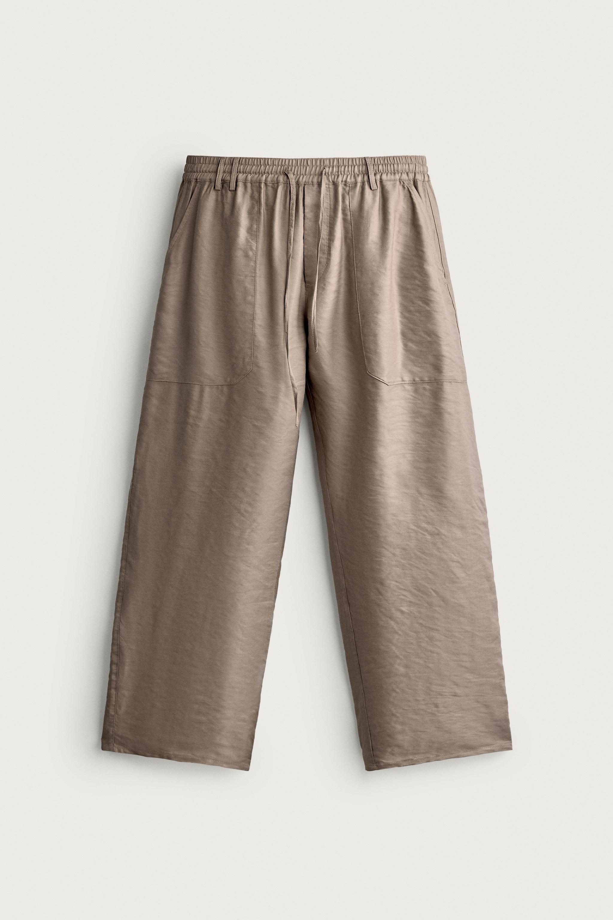 RELAXED FIT FLOWY PANTS — Beige-pink