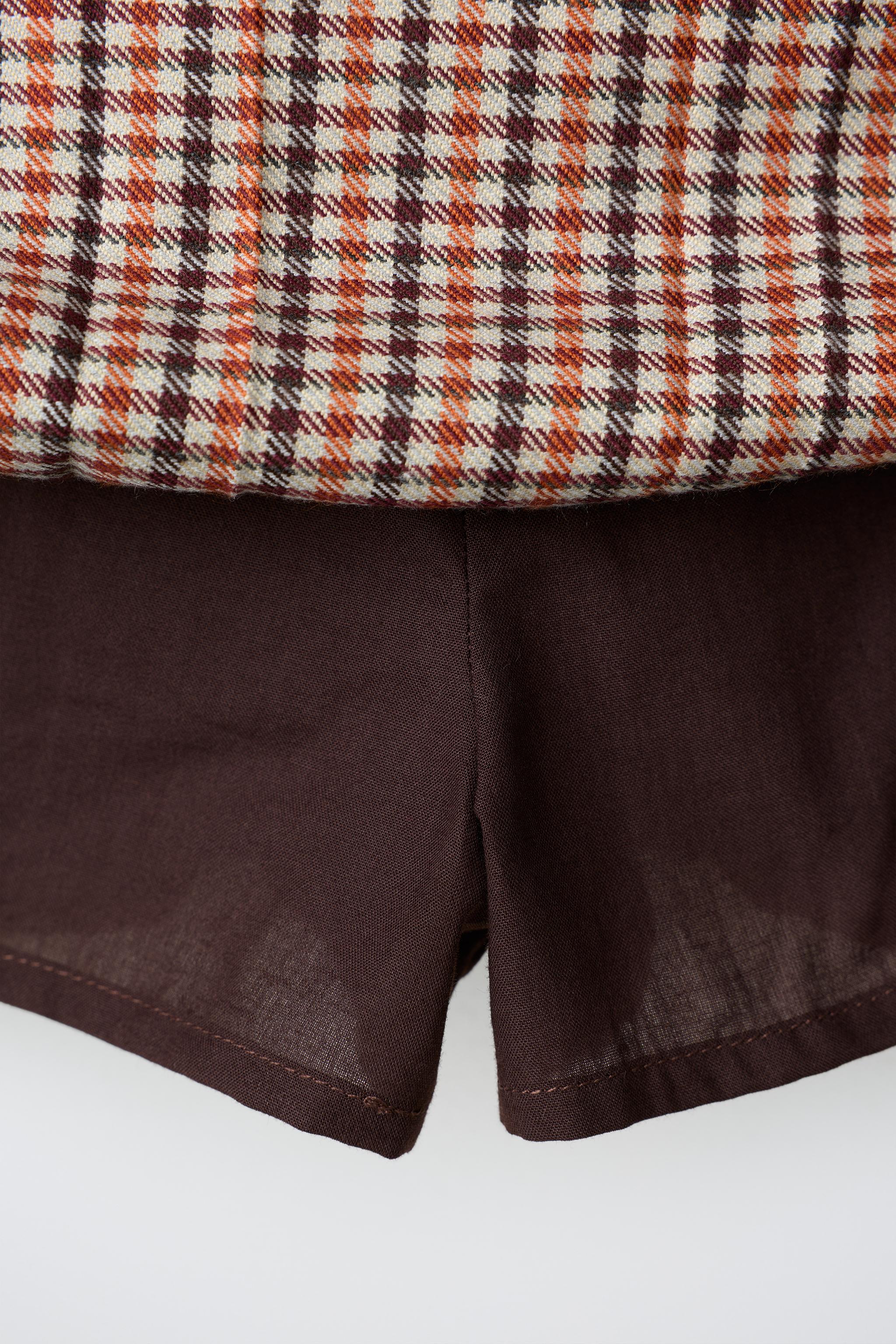 PLAID PLEATED SKIRT WITH FROG FASTENING