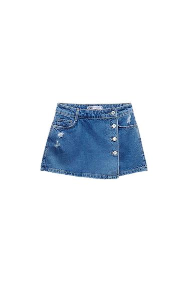 Blue denim miniskirt with front buttons and distressed details. Visible label at the waist. White background.