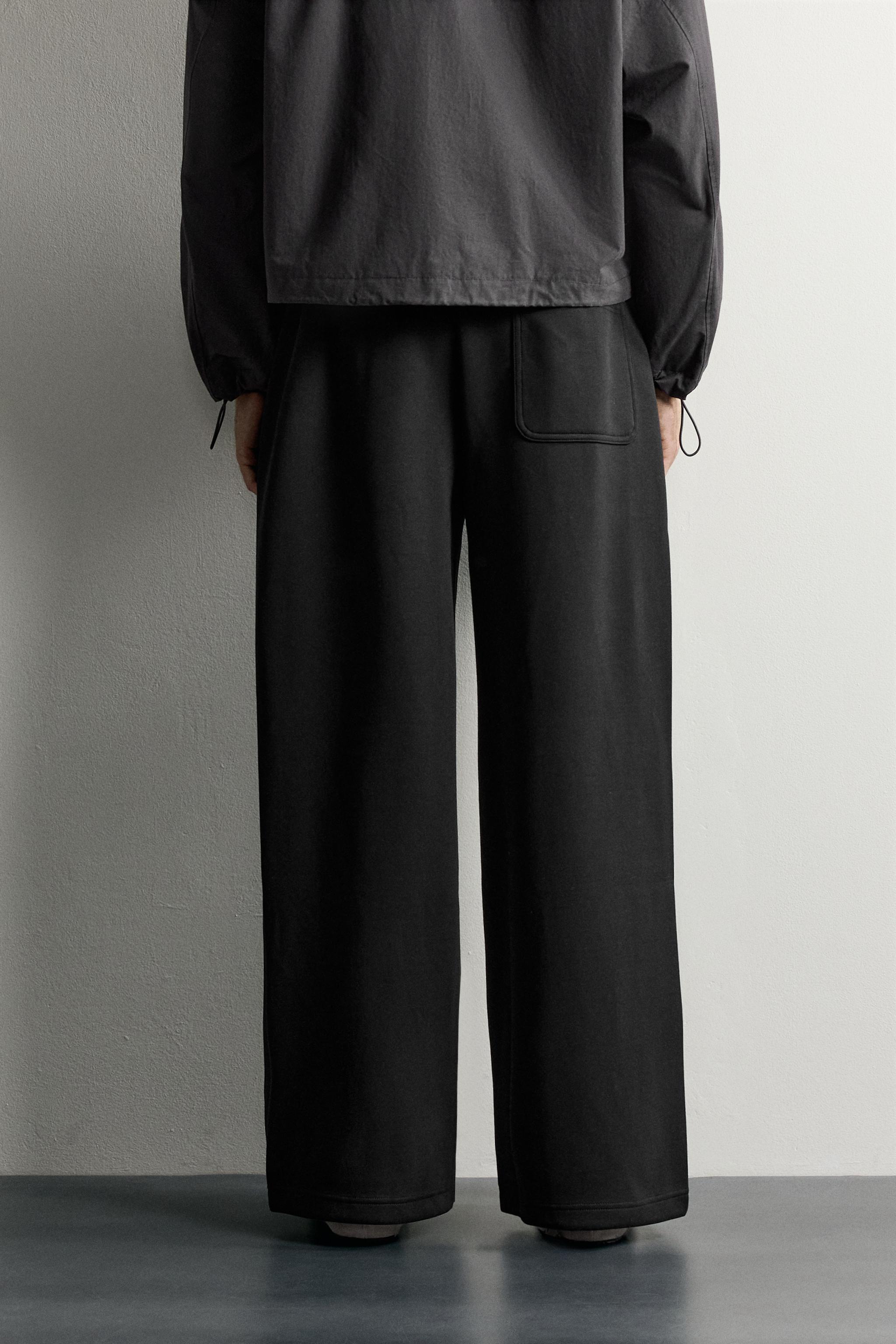 PLEATED BALLOON-FIT PANTS