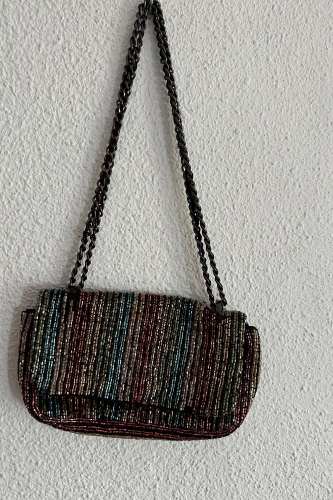 Front view of bag with coloured beads and metal chain.