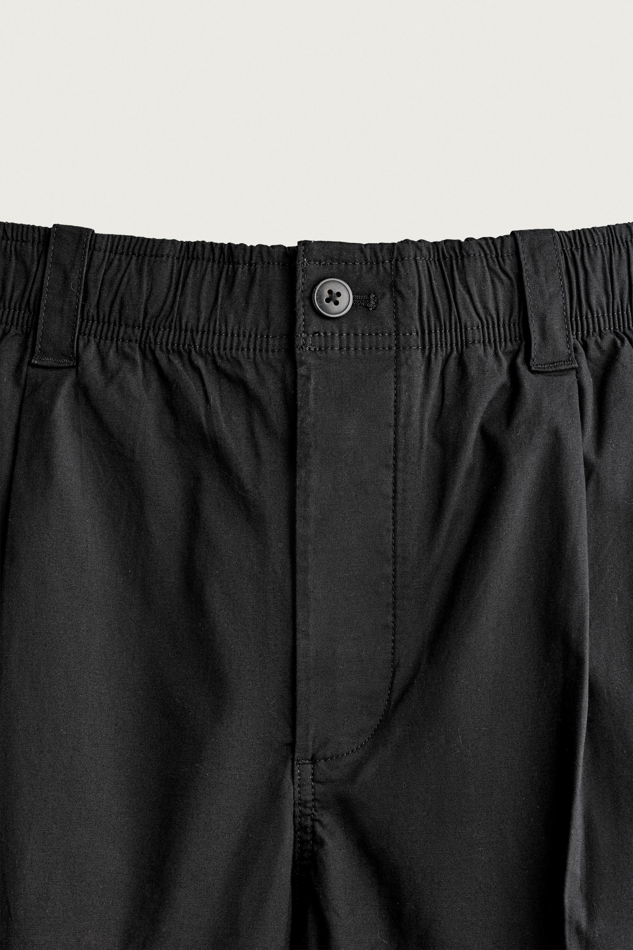 PLEATED RELAXED-FIT PANTS