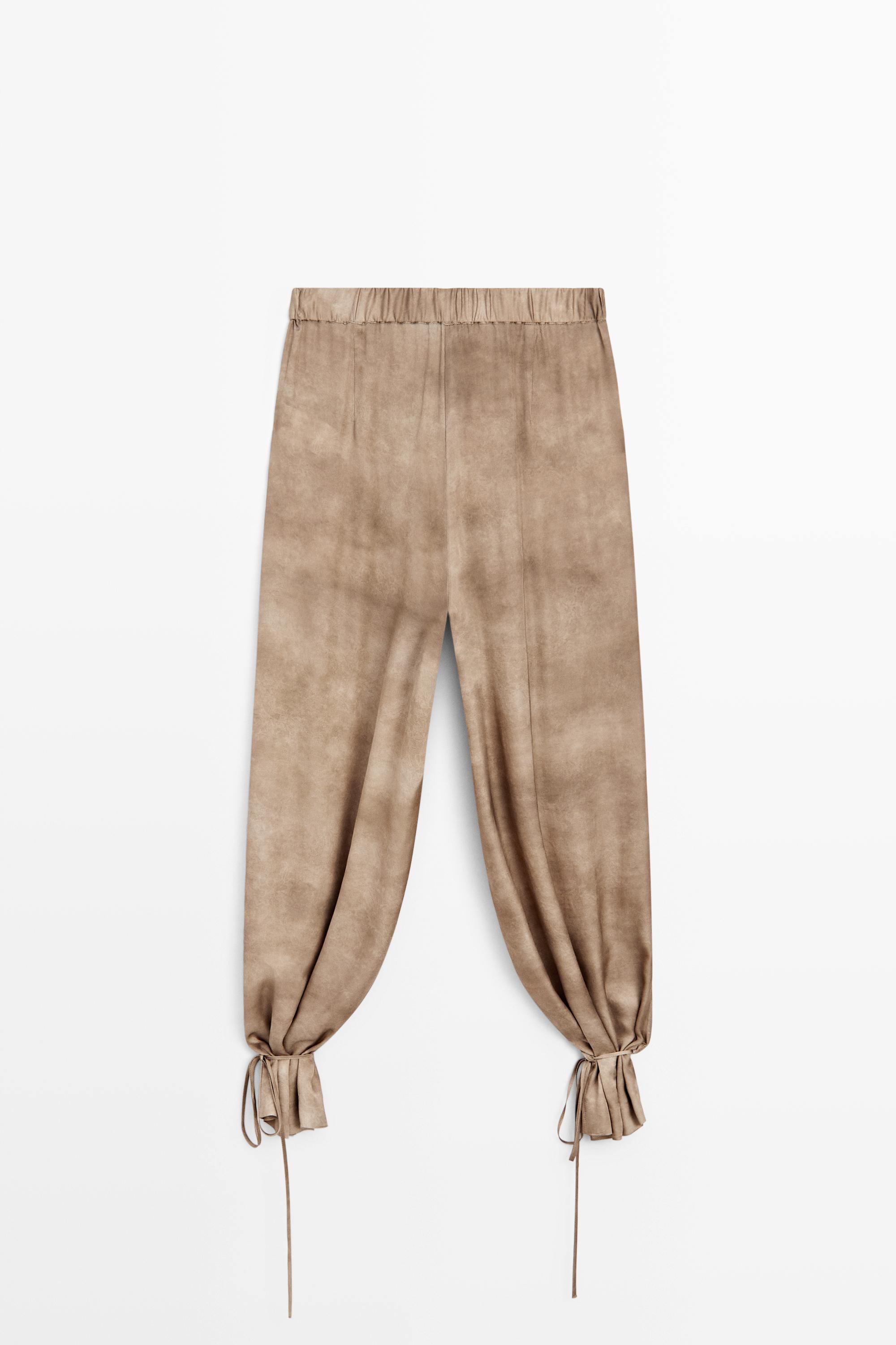 Flowing pants with tie-detail hem