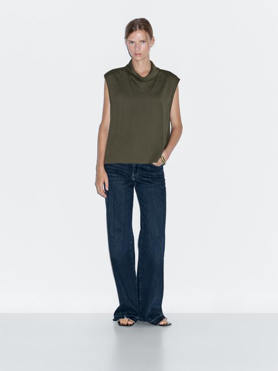 Flowing blouse with draped neck detail