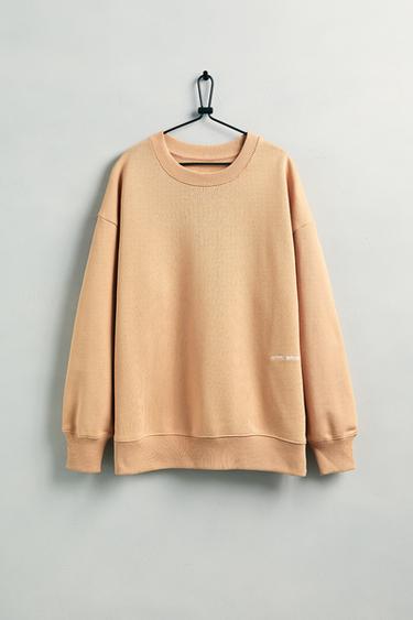 ÁO NỈ MÀU TRƠN THÊU CHỮ - Màu cam từ Zara