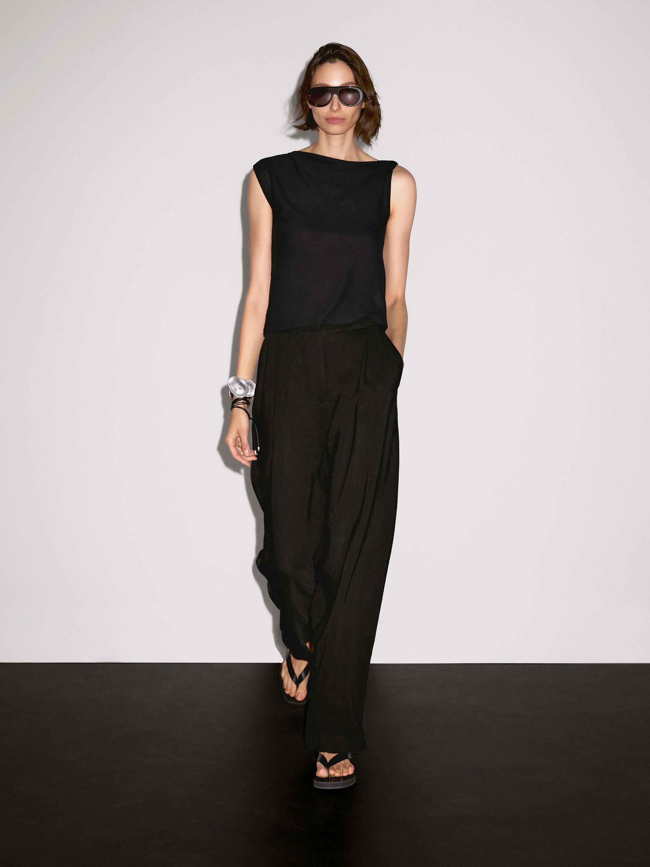 Asymmetric top with knot detail