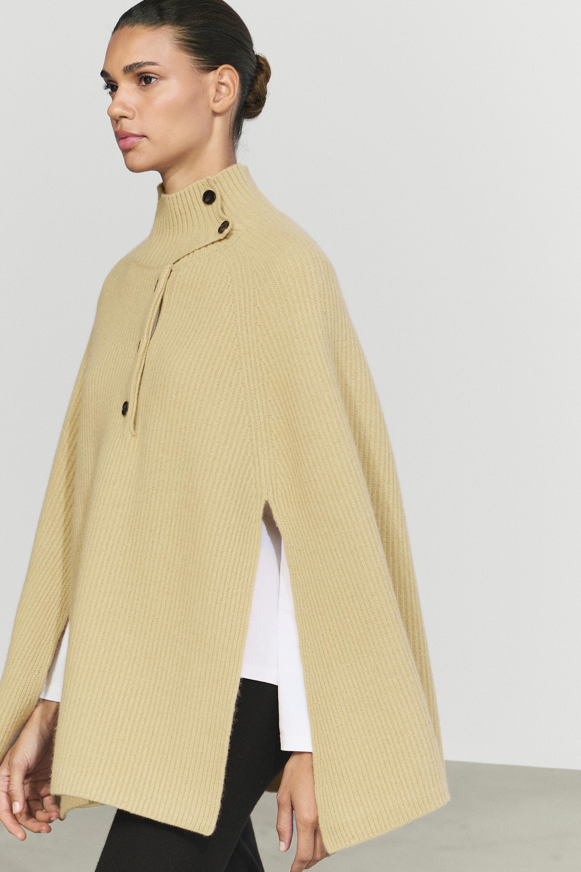 100% wool knit cape with button detail