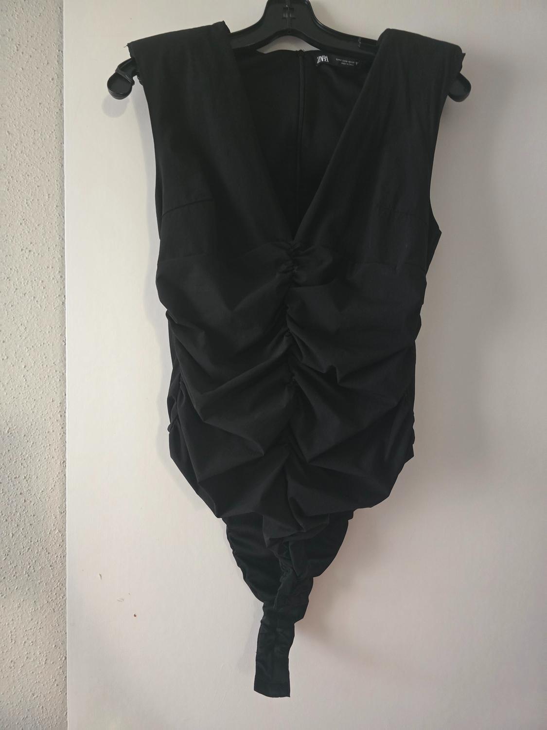 SHOULDER PAD DRAPED BODYSUIT