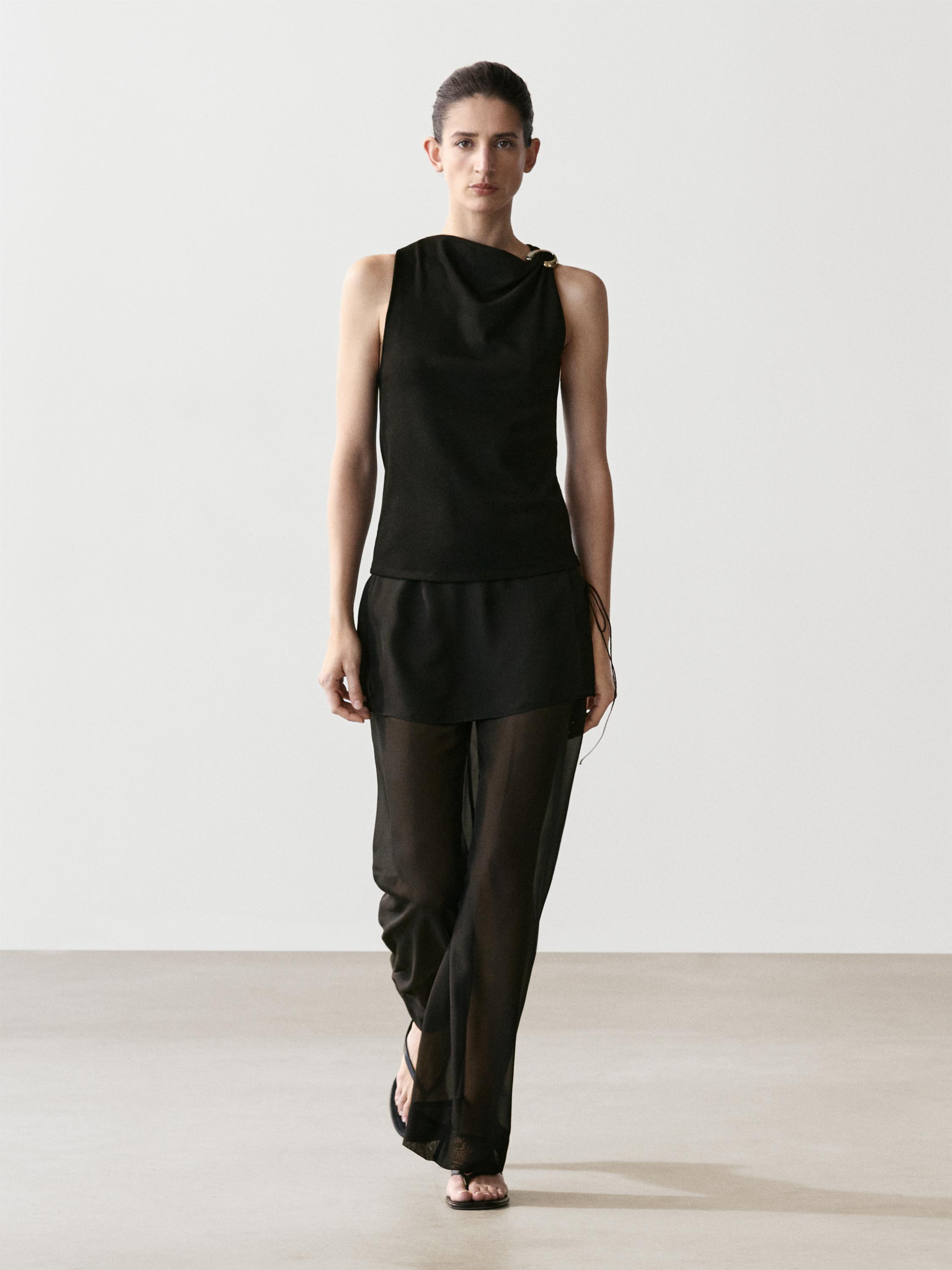 Draped neckline top with brooch detail
