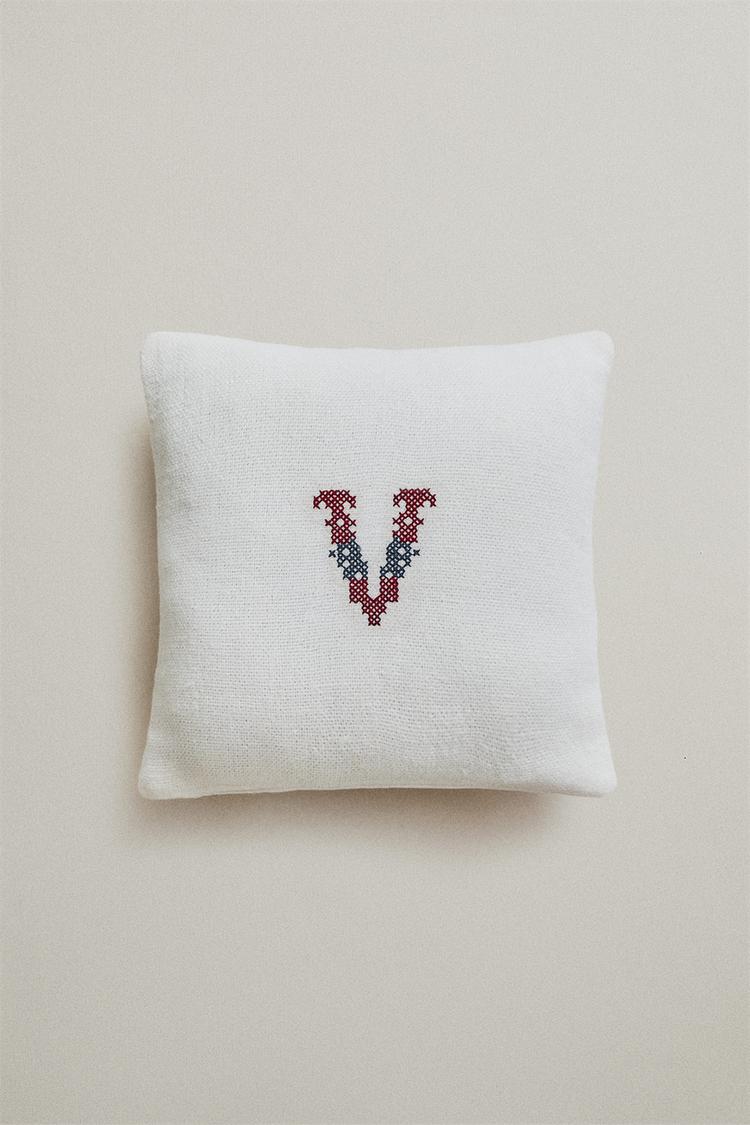 EMBROIDERED 'V' LETTER LINEN CUSHION — Ecru