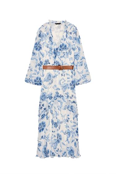 Front view of blue and white floral dress with brown belt, long sleeves, and V-neck.
