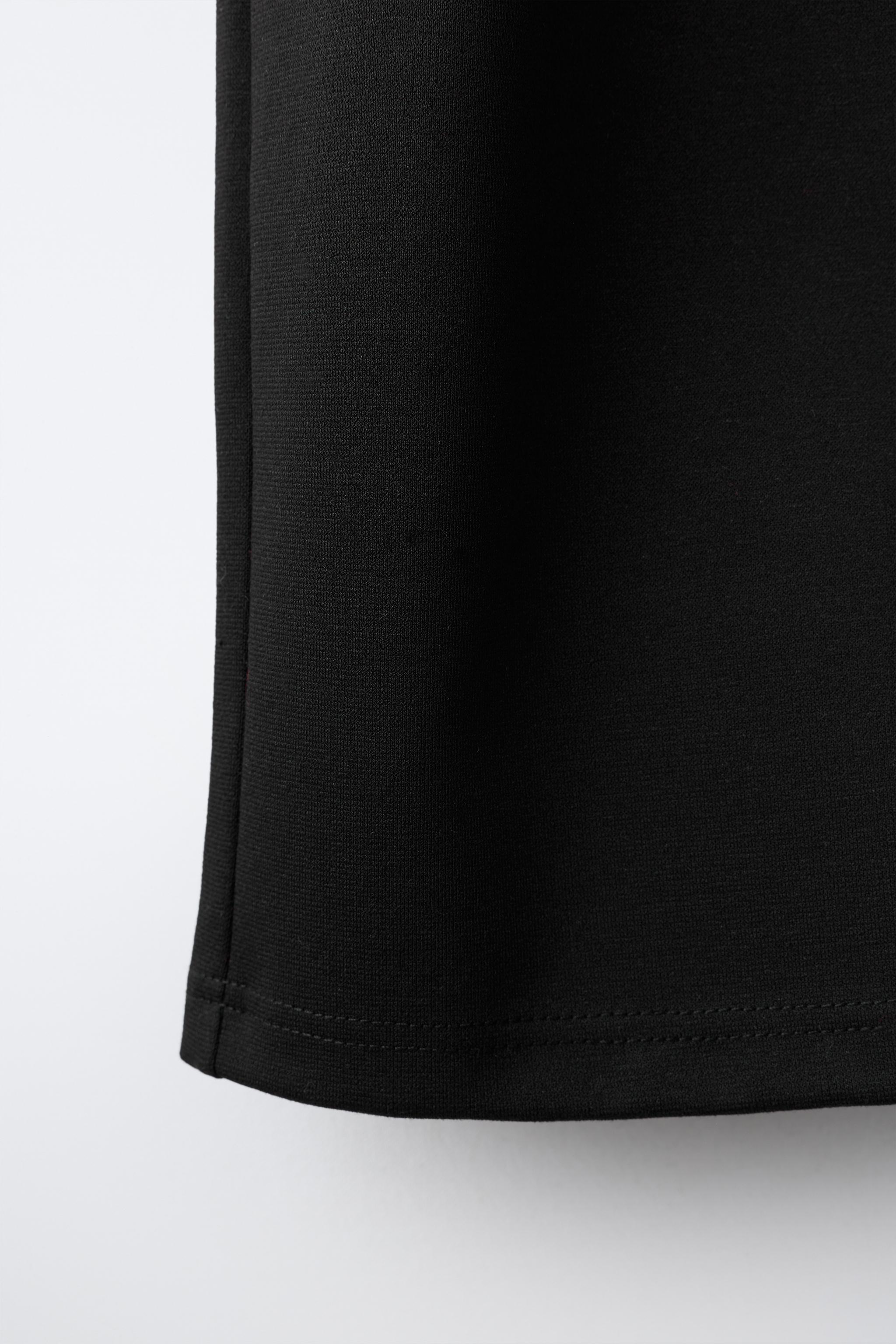 INTERLOCK PLEATED WIDE-LEG PANTS