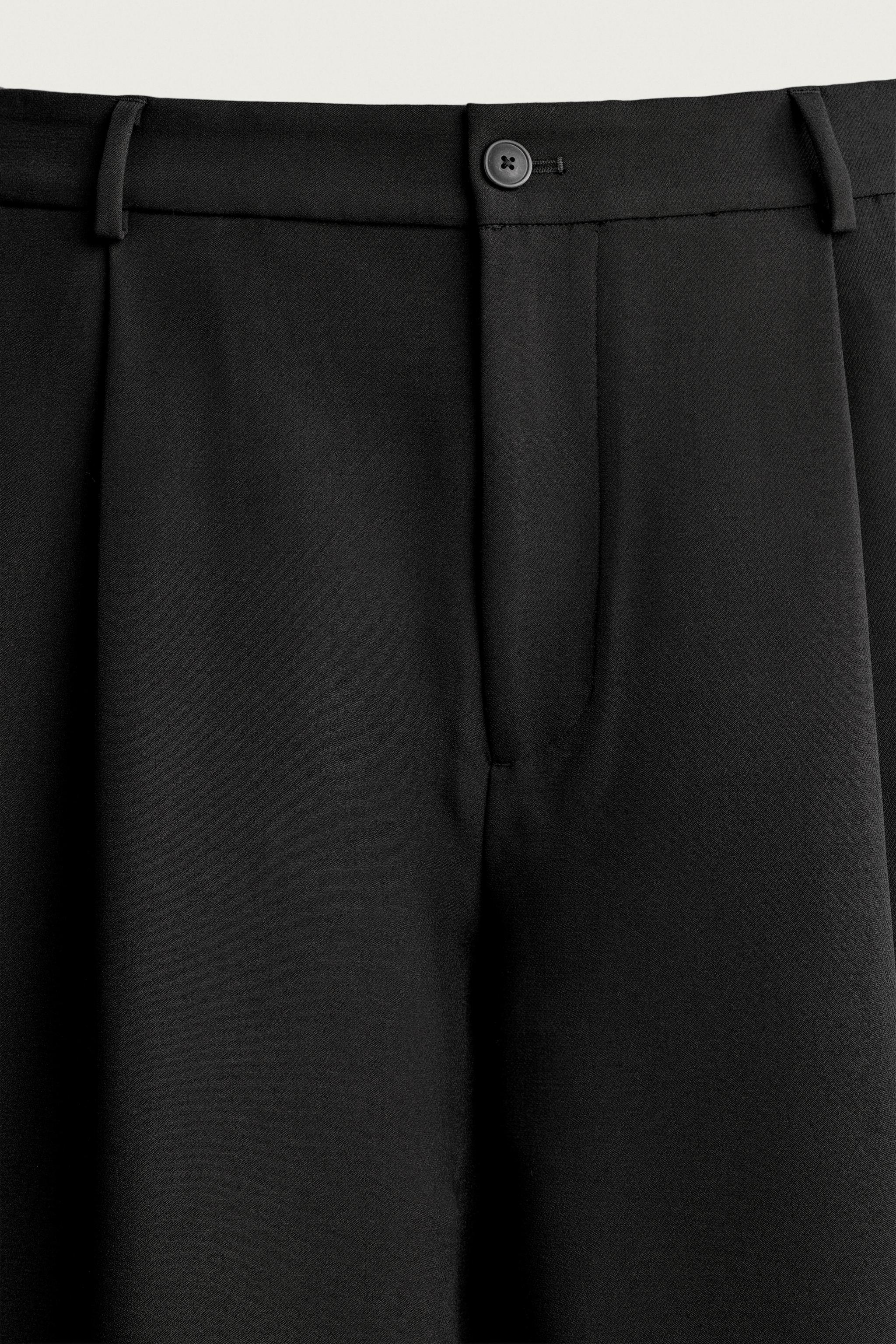 RELAXED FIT PLEATED PANTS
