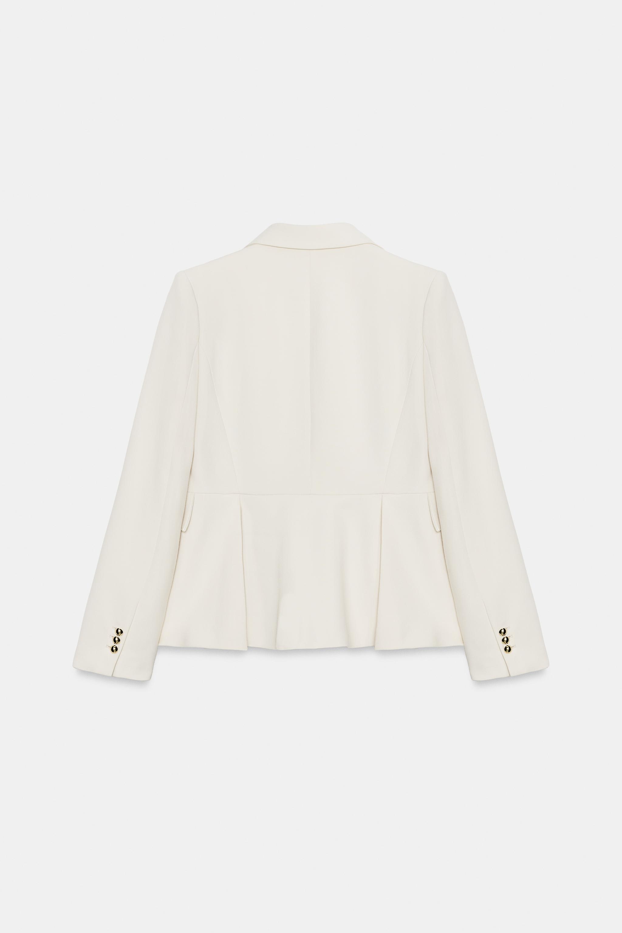 VESTE PÉPLUM À ÉPAULETTES