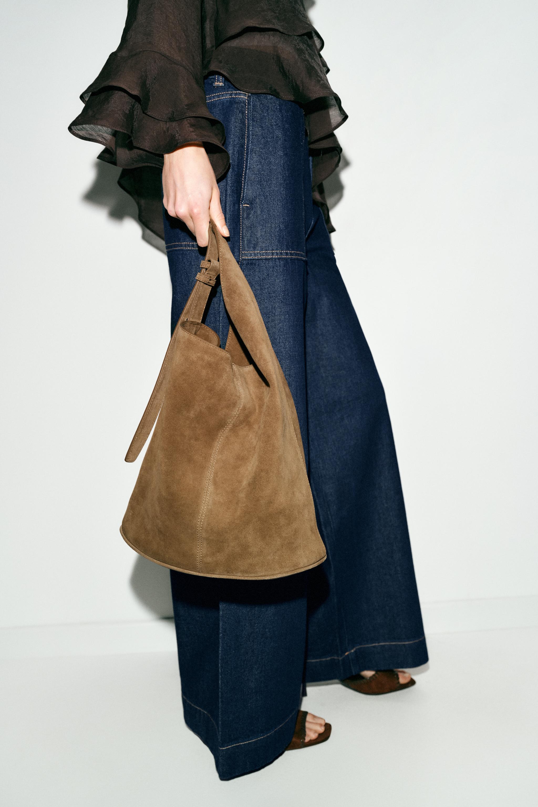 ASYMMETRIC LEATHER BUCKET BAG