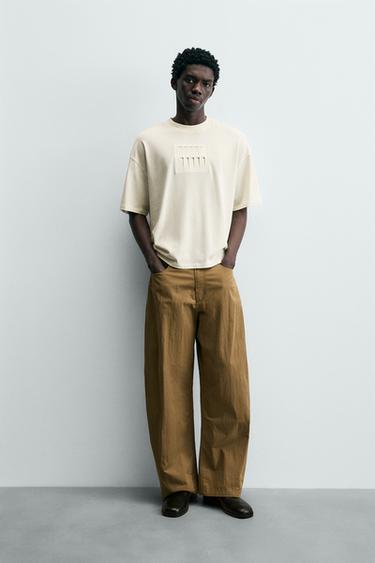 CAMISETA RELAXED FIT PARCHE - Blanco roto de Zara - Imagen 0