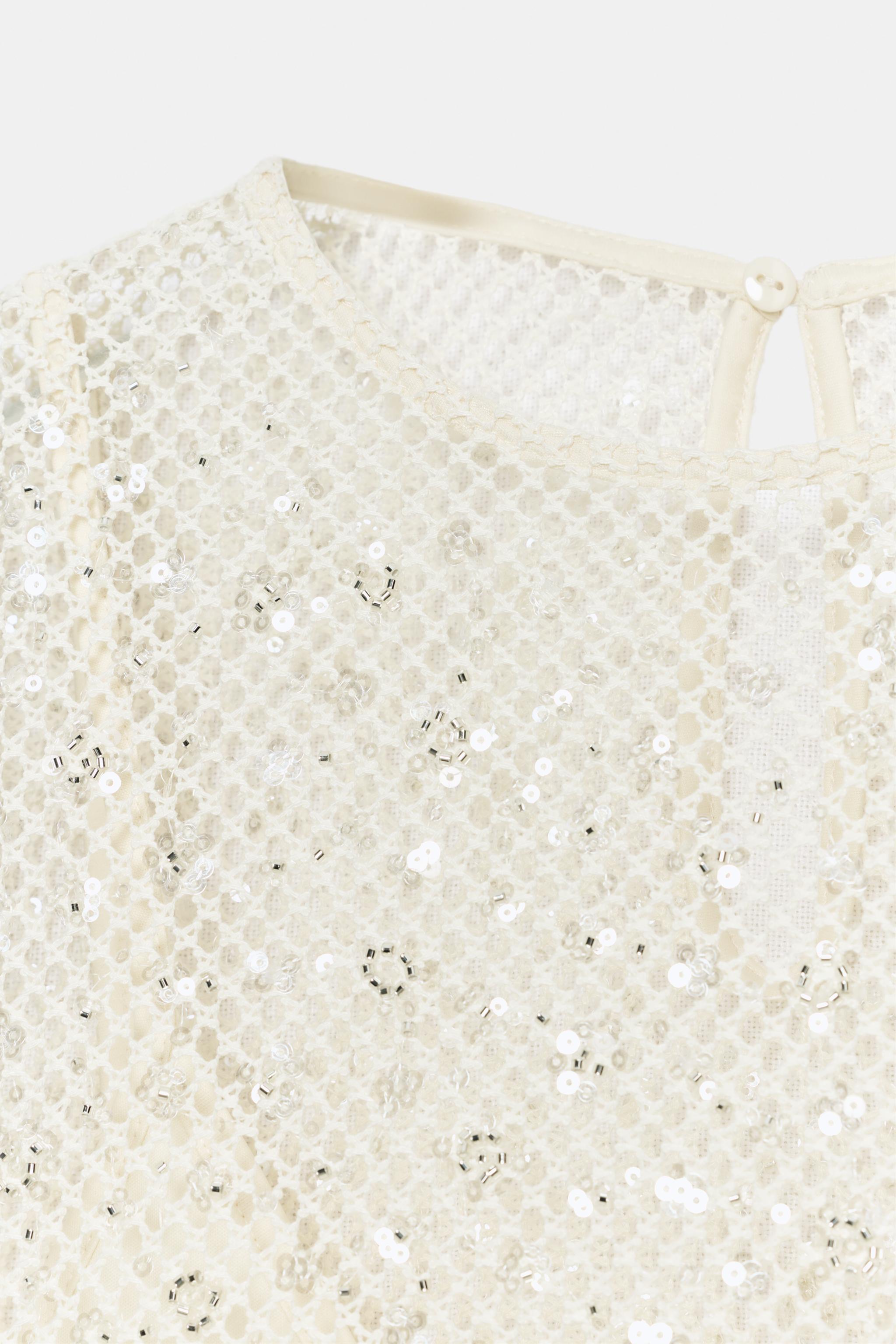 TOP RÉSILLE À PAILLETTES