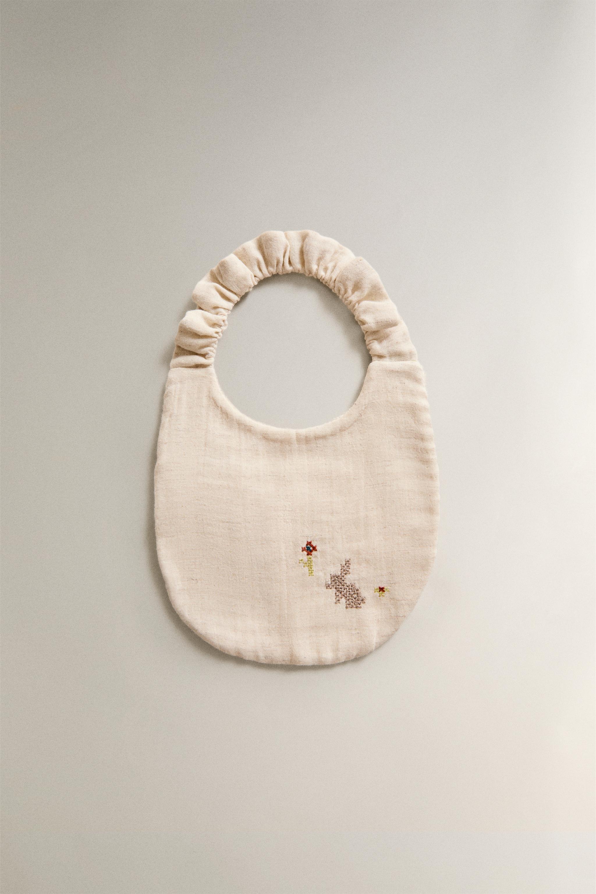 EMBROIDERED MUSLIN BABY BIB — Light beige (alternate view)