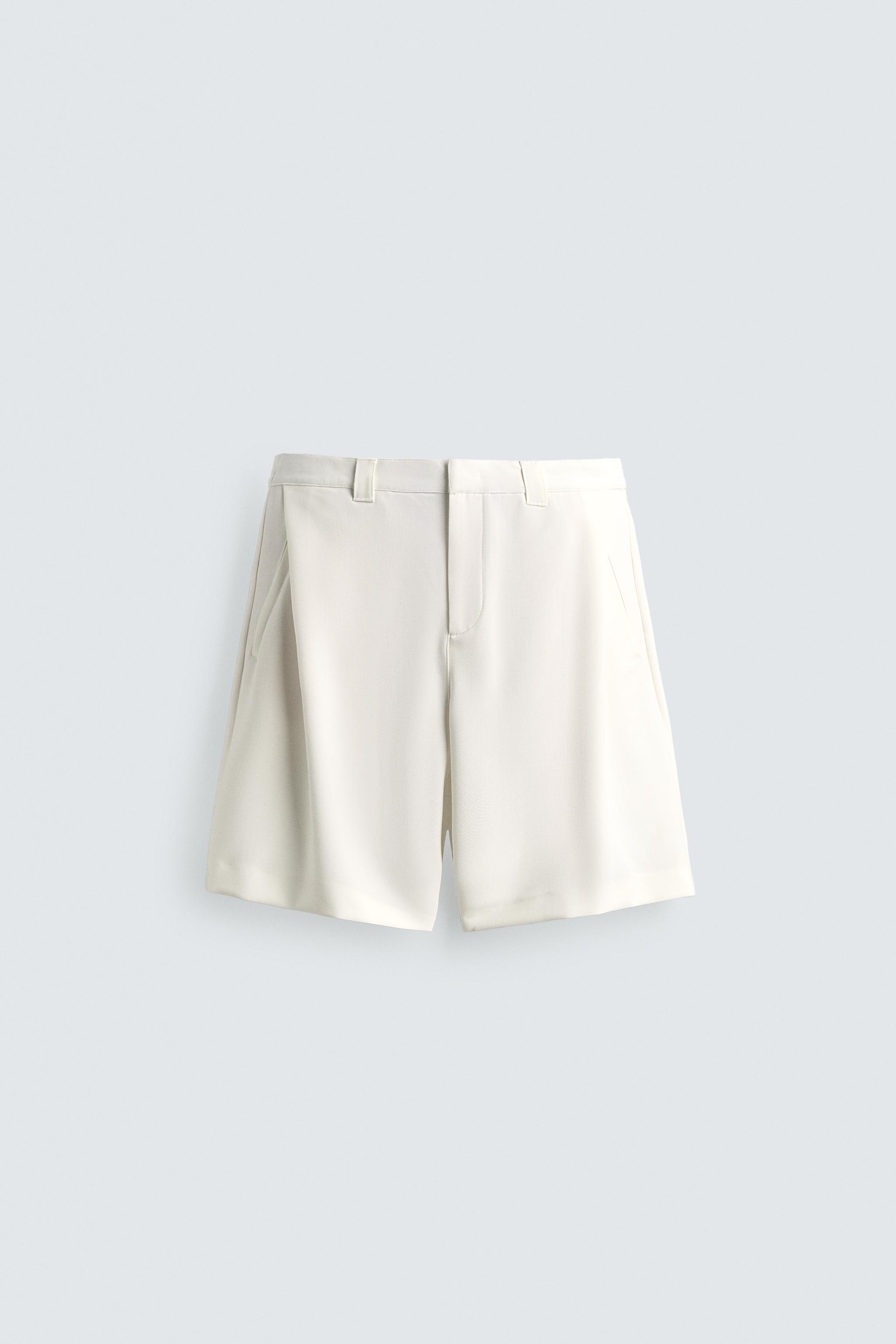RELAXED FIT SIDE PLEAT SHORTS — Oyster-white