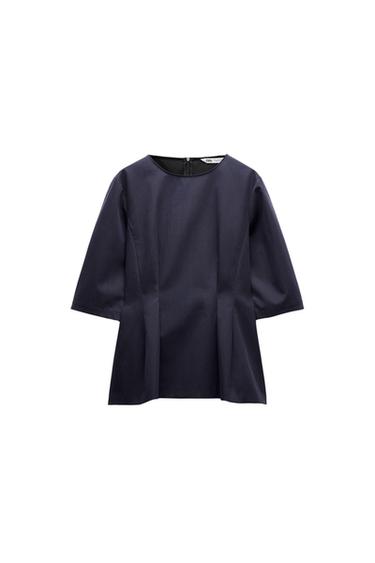 Front view of a navy blouse with three-quarter sleeves and concealed back zip fastening.