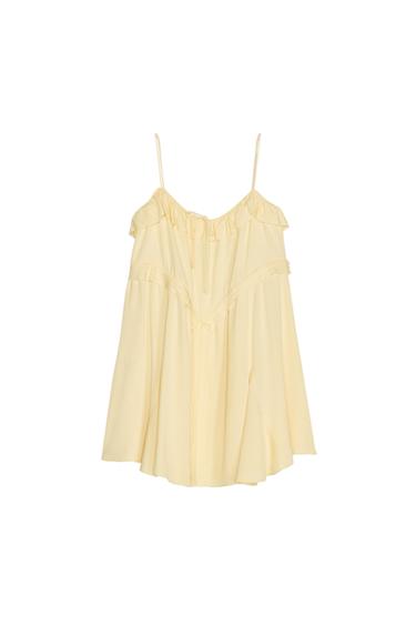 Front view of a yellow dress with spaghetti straps and frills on the neckline.