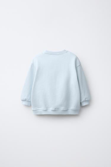 SUDADERA PERRITO RIZO - Azul claro de Zara