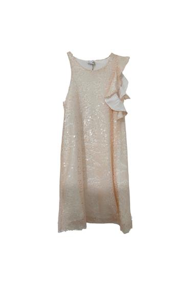 Sleeveless beige dress with sequins and ruffles on one side, hanging on a white background.