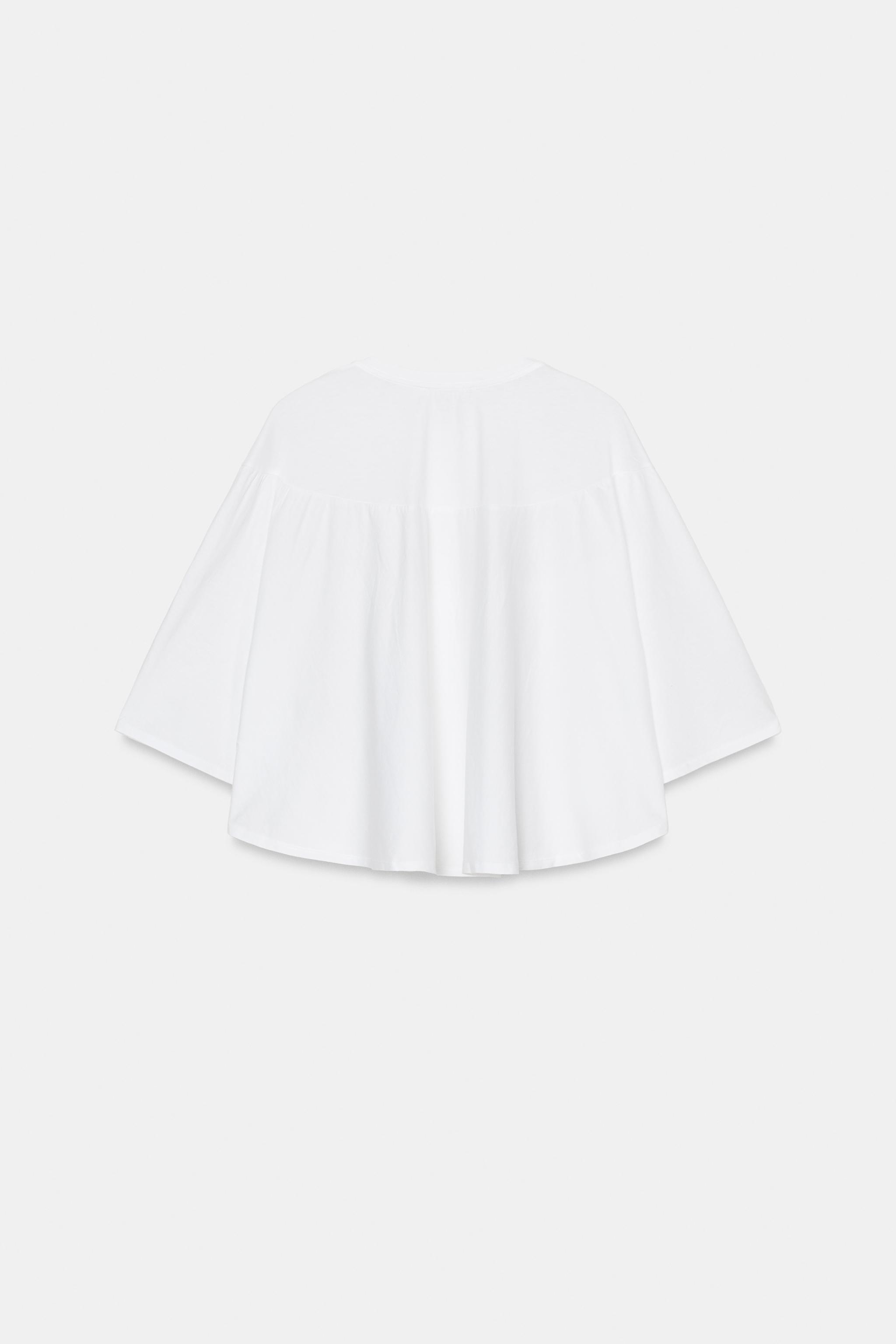 EMBROIDERED CAPE TOP