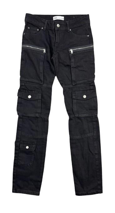 Black cargo trousers with multiple pockets and silver zips. Visible label at the waist.