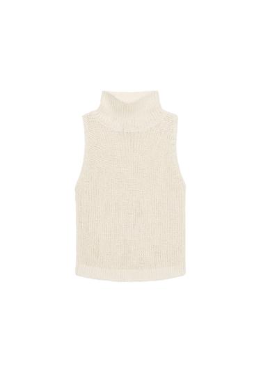 Light ecru sleeveless top, high neck, knitted fabric, straight hem.