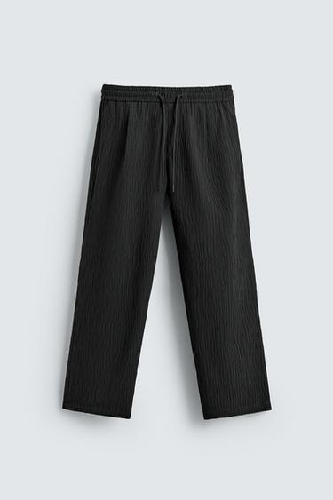 RELAXED FIT EMBOSSED TROUSERS - Black by Zara