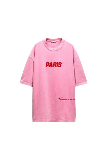Pink T-shirt with red "PARIS" text on the chest. Additional detail: "Rue du Pont Neuf 15, 75001 Paris" at the bottom.
