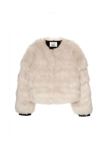 Cream faux fur jacket with visible Zara label on the collar, on a white background.