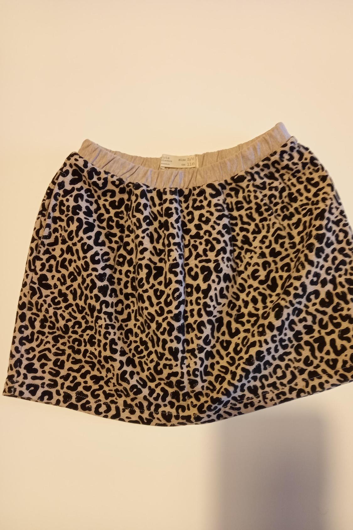 Front view of skirt with animal print in dark shades and elasticated waist.