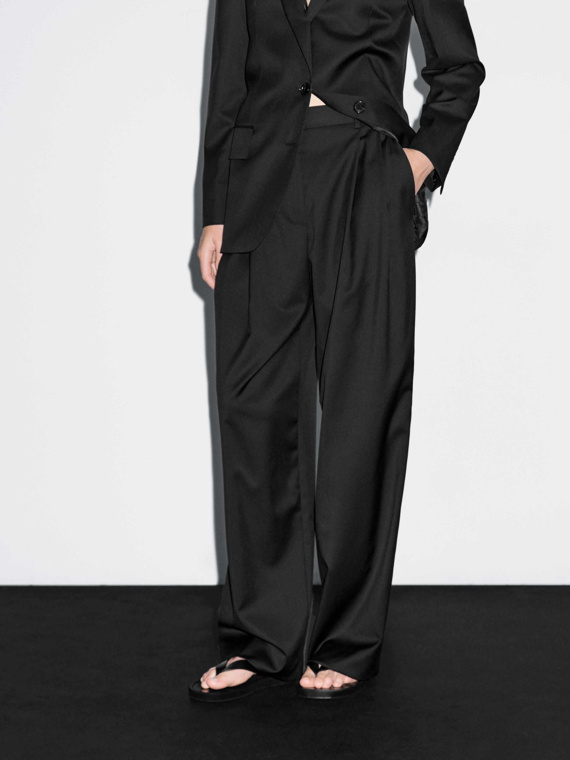 100% extra fine wool pleated trousers