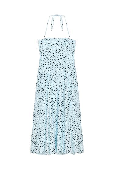Front view of a blue dress with black polka dots, a halter neckline, and a full skirt.